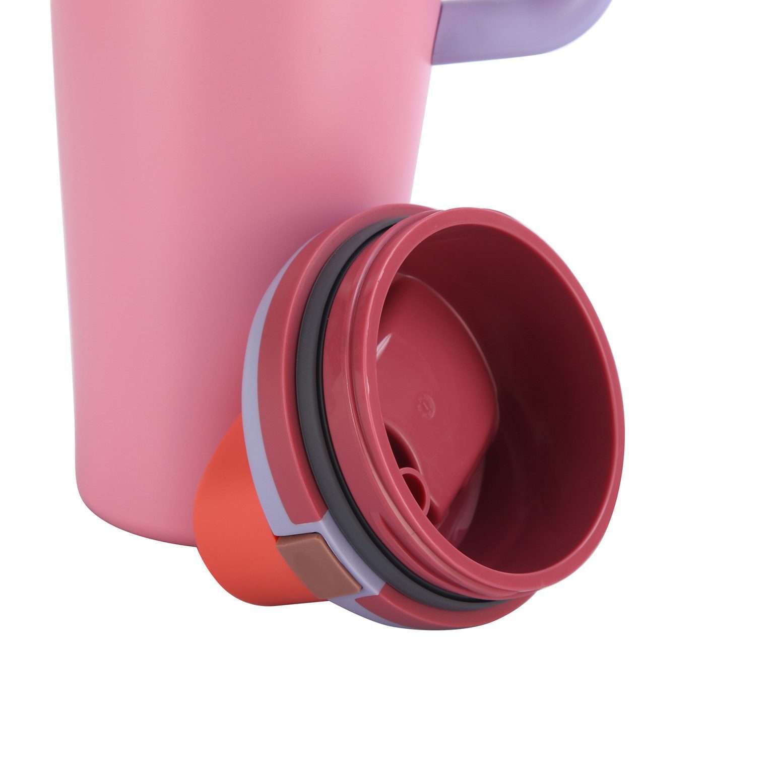 Detached pink travel taza lid showing its underside and sealing ring.